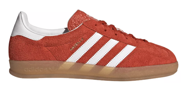Adidas Gazelle sneakers in red suede with white stripes and gum sole, classic retro Adidas shoes for casual streetwear style.
