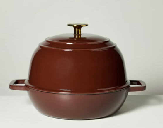Brown enameled cast iron Dutch oven with gold knob lid, versatile round braiser and baking dish for cooking and roasting.