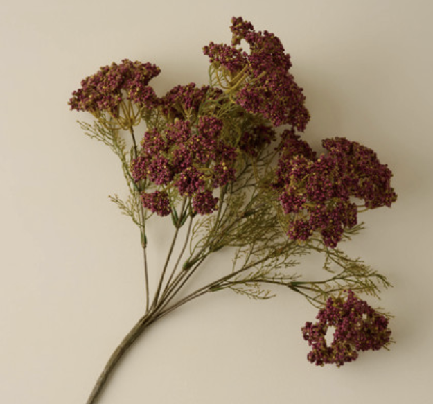Artificial burgundy yarrow flower stem with delicate green foliage, perfect for fall floral arrangements and home decor styling.