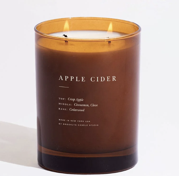 Amber candle labeled apple cider