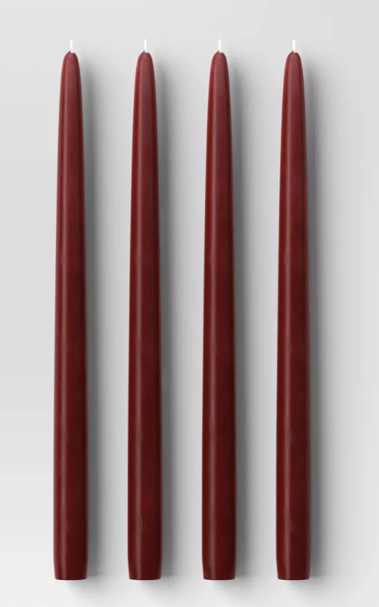 Four tall burgundy candles arranged vertically perfect for fall decorating.