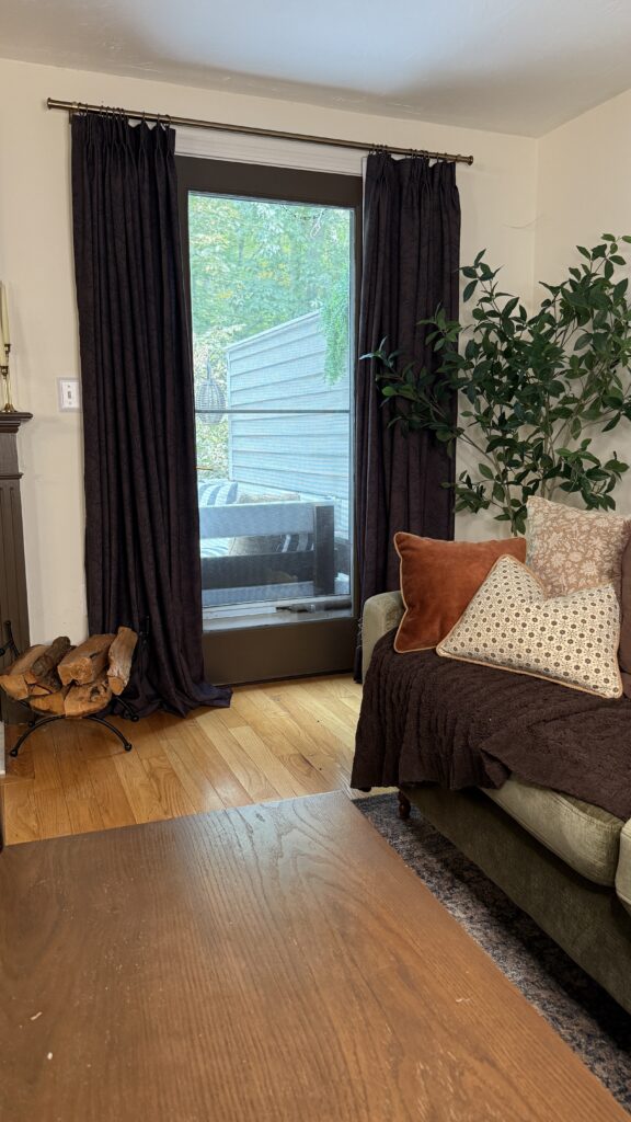 Cozy living room with dark curtains.