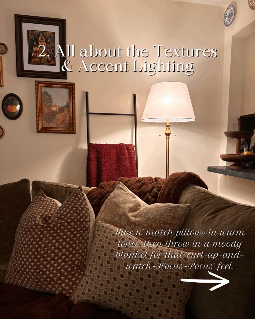 A cozy corner decorated for fall with an eclectic gallery wall, blanket ladder, floor lamp, and cozy layered throw pillows.