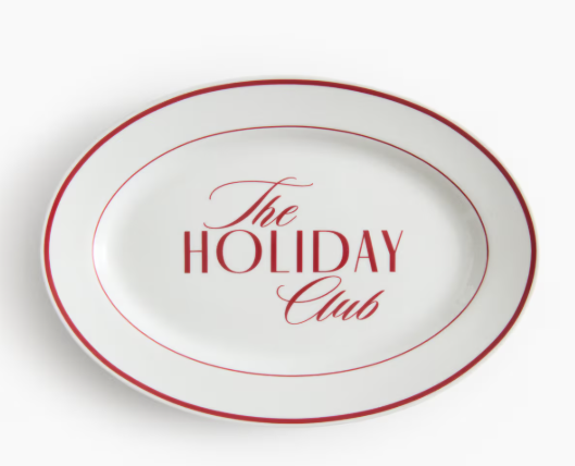 Oval white ceramic platter from H&M Home with red trim and the words “The Holiday Club” in elegant red script — a vintage-inspired serving dish perfect for Christmas gatherings and holiday tablescapes. Christmas Decor