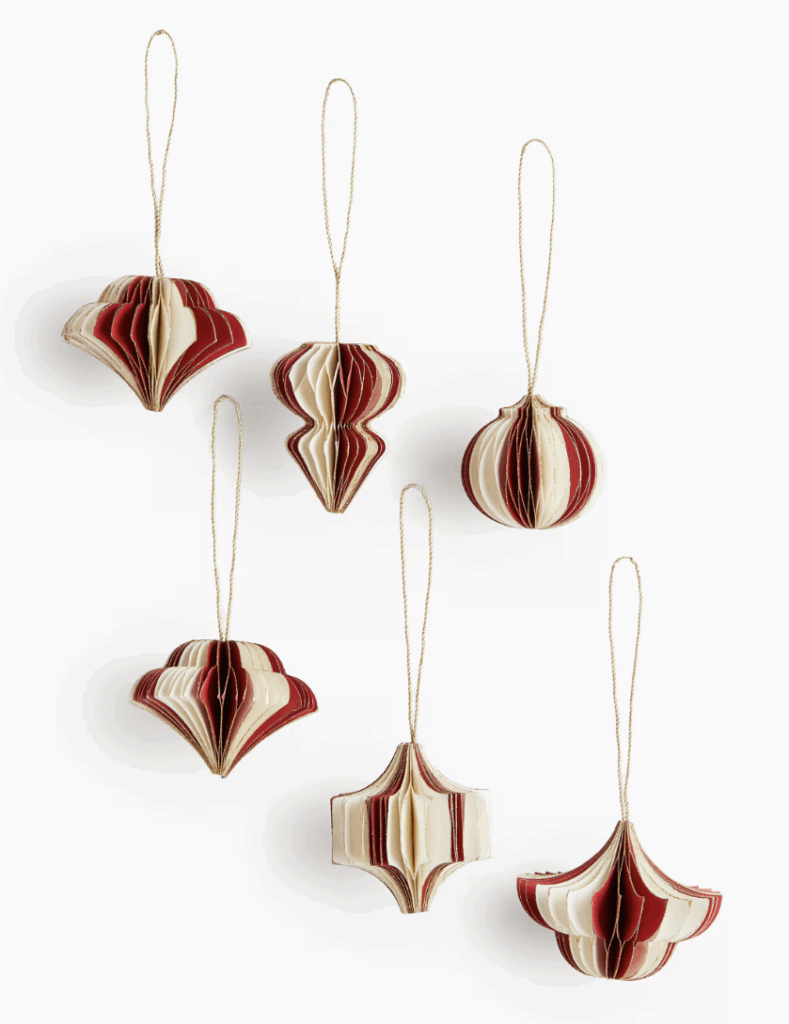Set of six red and white paper Christmas ornaments from H&M Home, featuring vintage-inspired cabana stripes and elegant shapes — perfect for traditional holiday decorating or a cozy cottage-style Christmas tree. Christmas Decor ornaments.