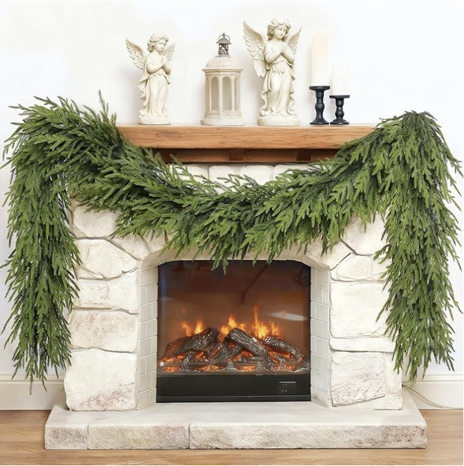 Cozy Christmas mantel decorated with lush green cedar garland and neutral holiday decor. Perfect inspiration for traditional, classic Christmas styling and cozy home interiors that feel warm, festive, and timeless.