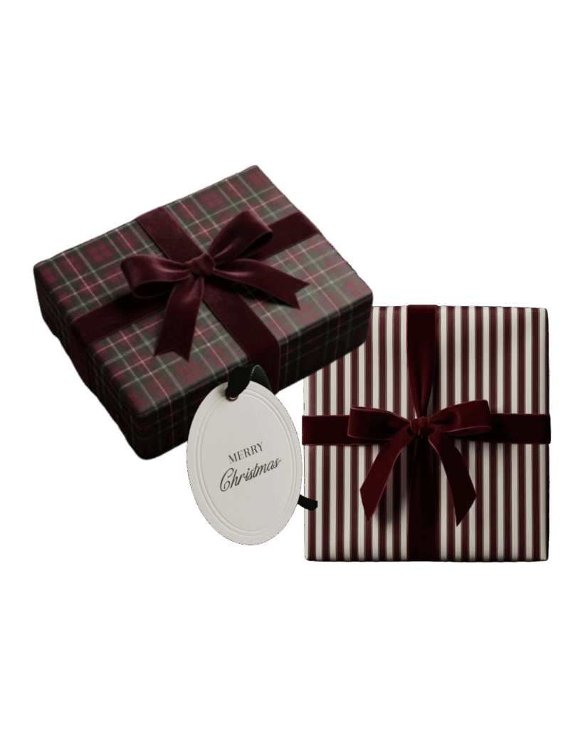 wo wrapped gifts, one in burgundy plaid paper and one in burgundy-striped paper, both with velvet ribbon and round “Merry Christmas” tag.