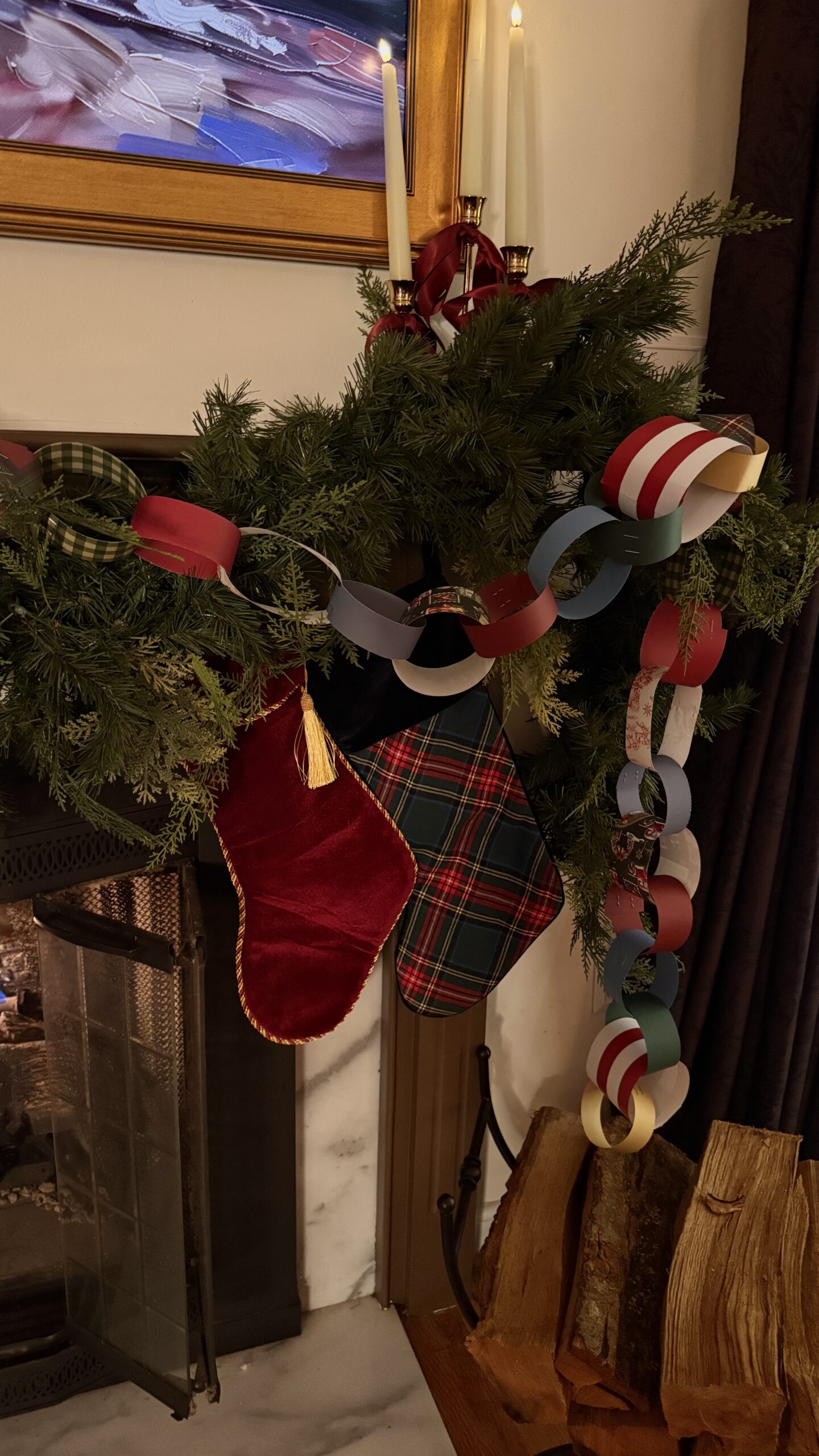 Close-up of a whimsical Christmas tree decorated with handmade paper chain garlands, vintage-style ornaments, velvet ribbons, and warm candle-style lights, creating a cozy and nostalgic holiday look.