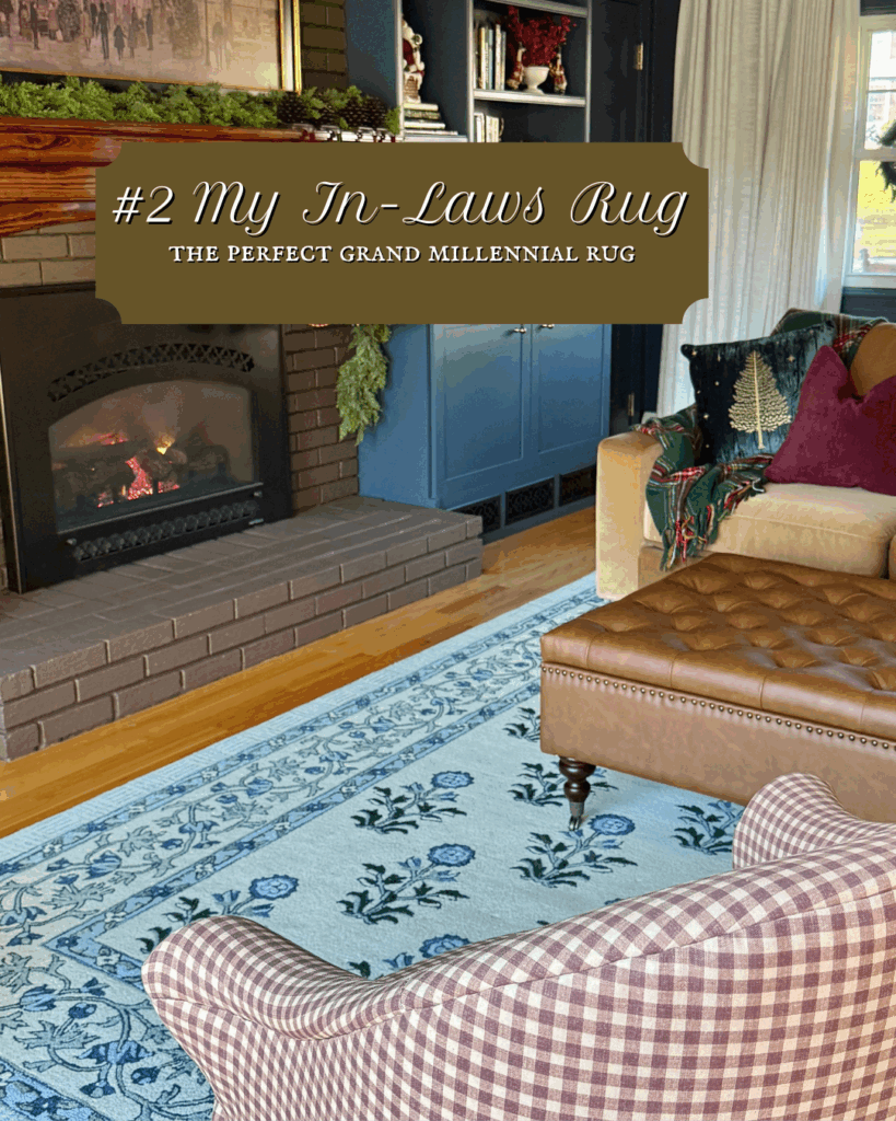 Living room with a blue vintage-style area rug layered in front of a brick fireplace, flanked by blue built-in cabinets and cozy seating.