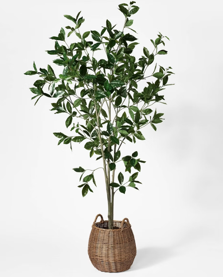 Artificial plant in woven basket.