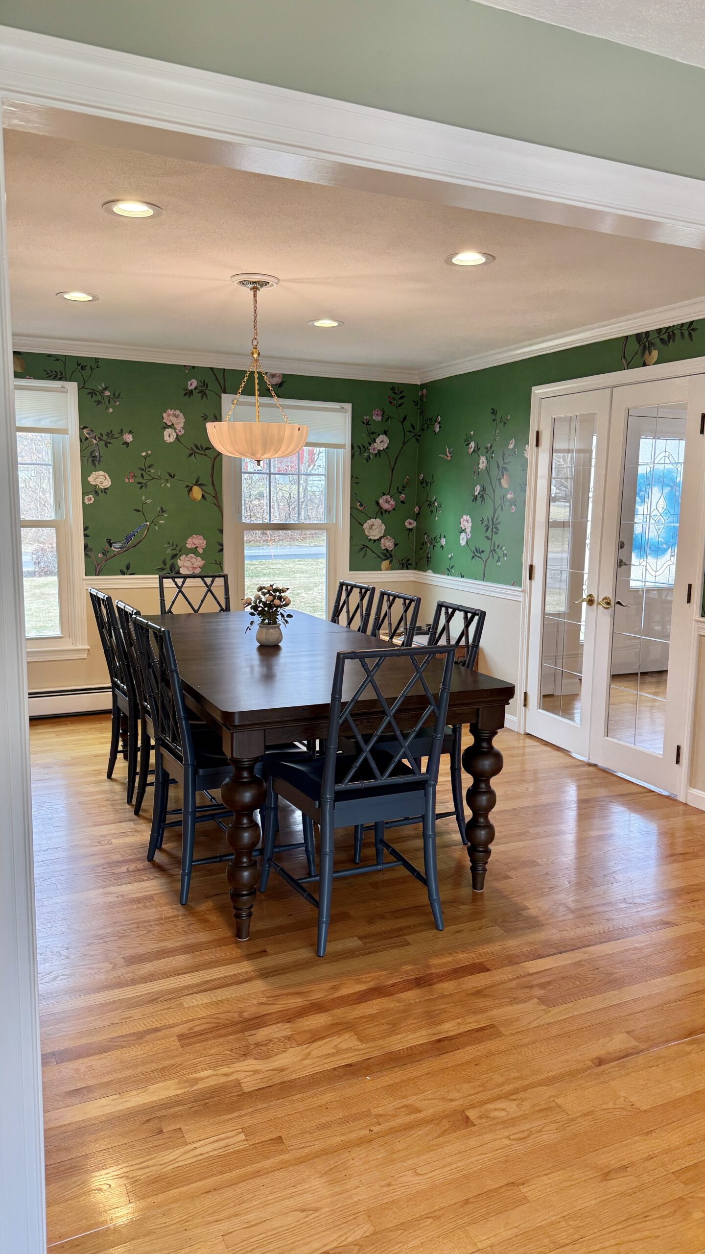 Elegant dining room with floral wallpaper