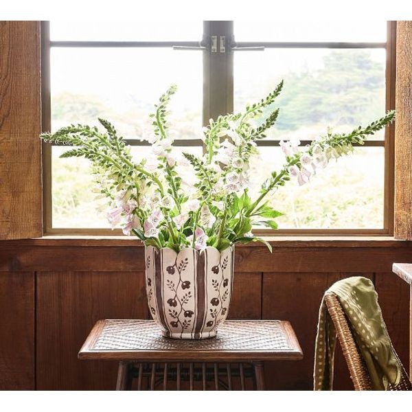 Greenrow Ina hand glazed ceramic floral vase with white flowers by a sunny window