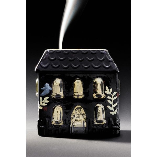 Haunted house figural glass candle in woody honeycrisp and pinecone