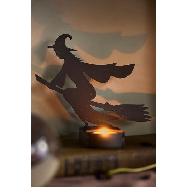 Shadow casting votive holder for October nights