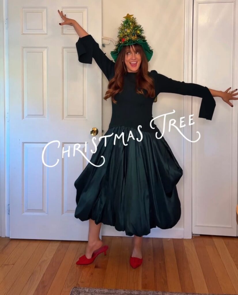 Christmas tree Halloween costume with a rented dark green bubble dress from Rent the Runway and a light up Christmas tree hat