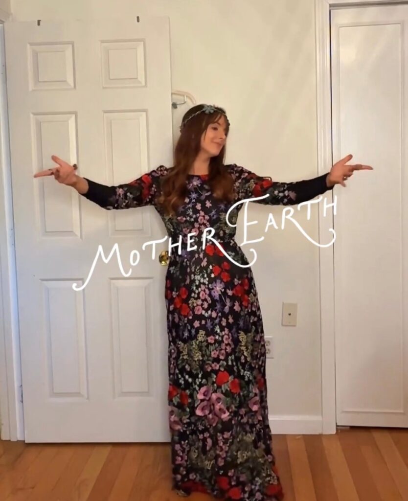 Mother Earth Halloween costume with a rented black floral embroidered maxi dress from Rent the Runway and a flower crown